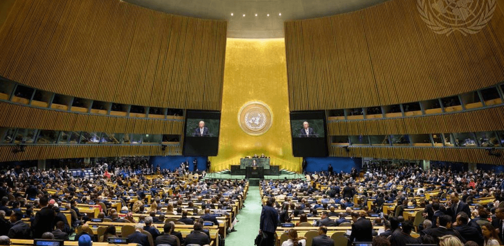A wide view of the United Nations General Assembly hall with many delegates seated.