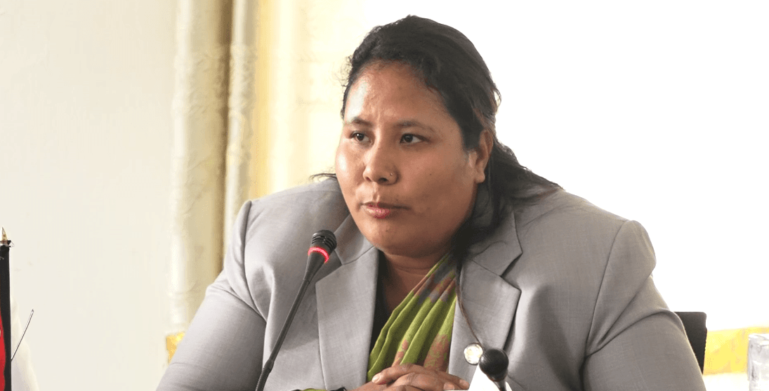 Minister Gita Chaudhary speaking at a meeting.