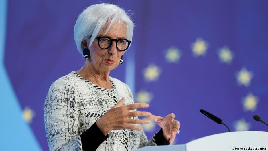 Christine Lagarde speaking at a podium with the European Union flag in the background.
