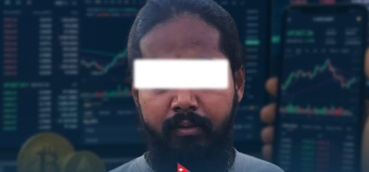 A man with his face blurred standing in front of a digital trading chart.