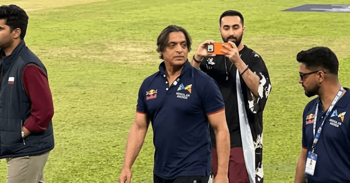 Shoaib Akhtar walking on the cricket field at the TU International Cricket Ground.