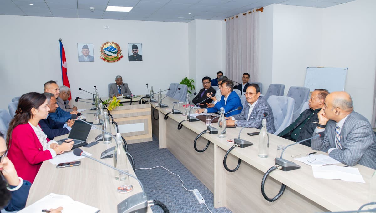 Government officials and private sector representatives meeting in a conference room.