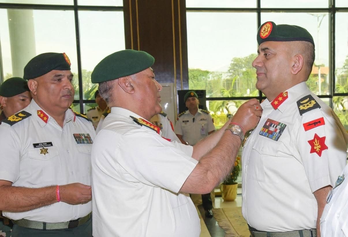 Chief of Army Staff Ashok Raj Sigdel confers rank insignia on a newly promoted senior officer.