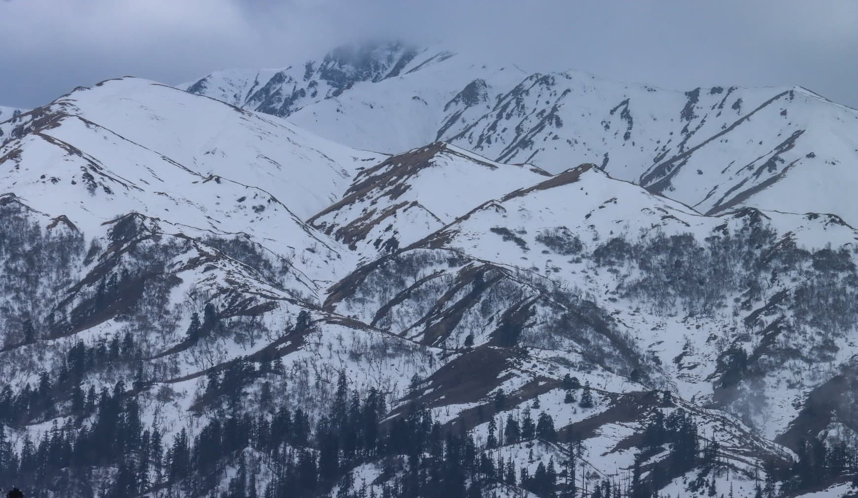 Snow-covered mountain peaks in the Badimalika region.