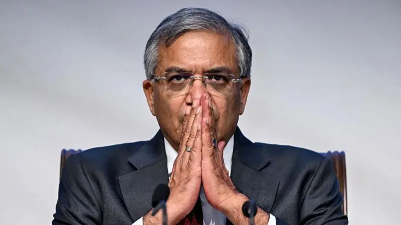 Chief Election Commissioner Gyanesh Kumar seated with his hands clasped in front of him.