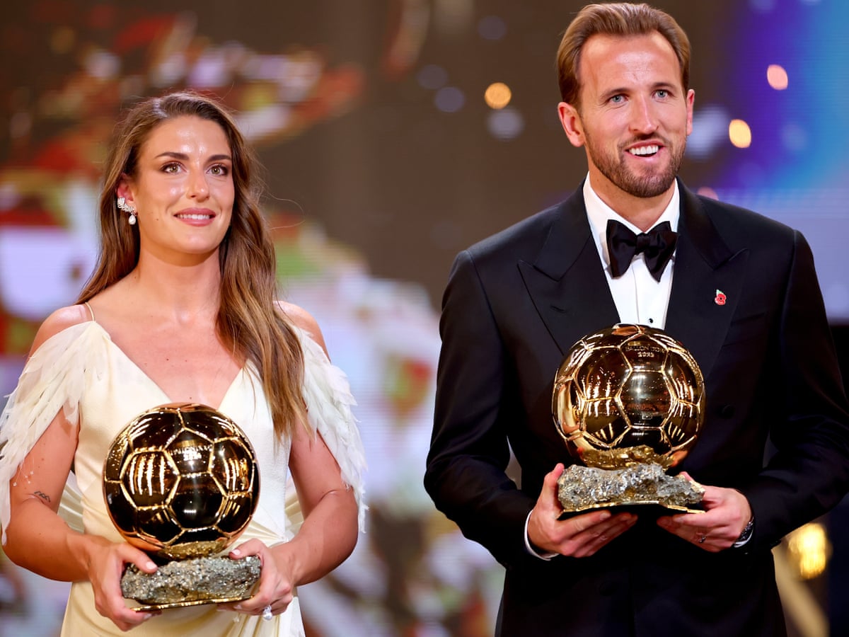 Alexia Putellas and Harry Kane holding their respective Ballon d'Or trophies at the ceremony.