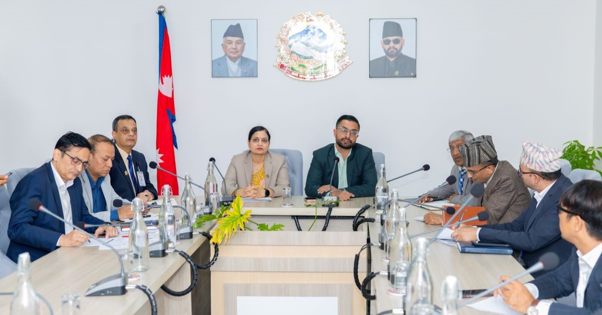 A group of government officials sitting around a conference table.