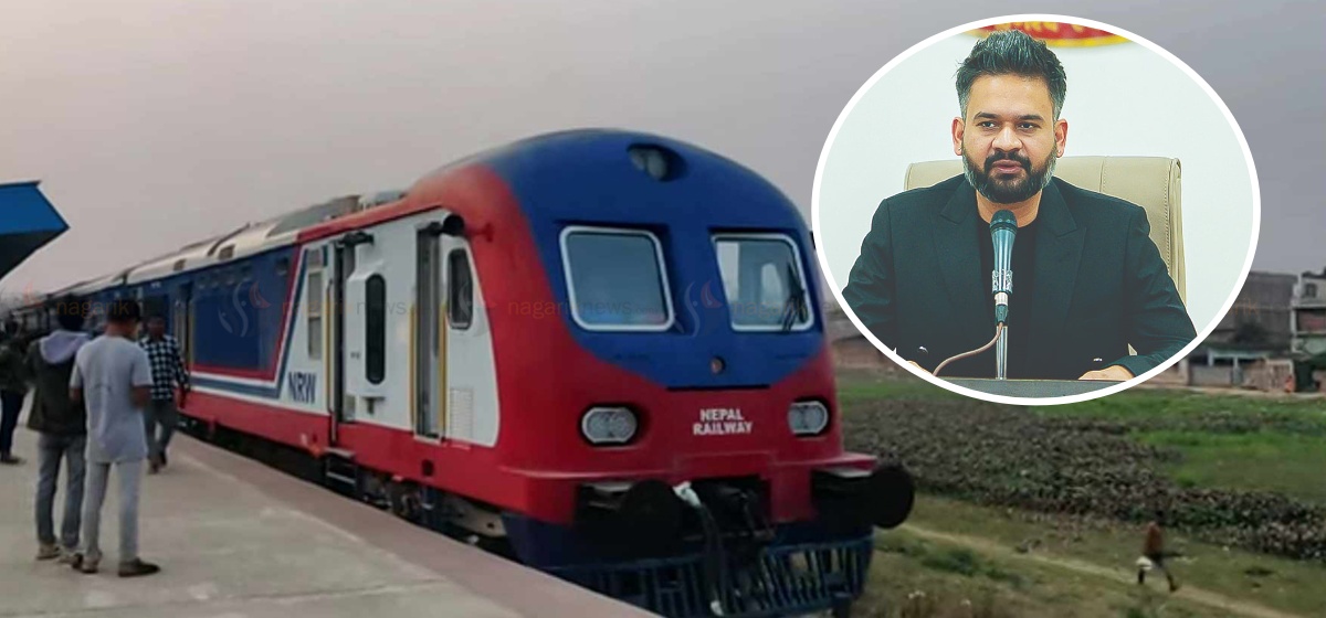 A Nepal Railway train at a platform alongside a portrait of Prime Minister Balen Shah.