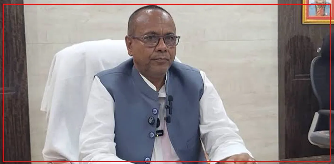 Chief Minister Krishna Prasad Yadav sitting at his desk.